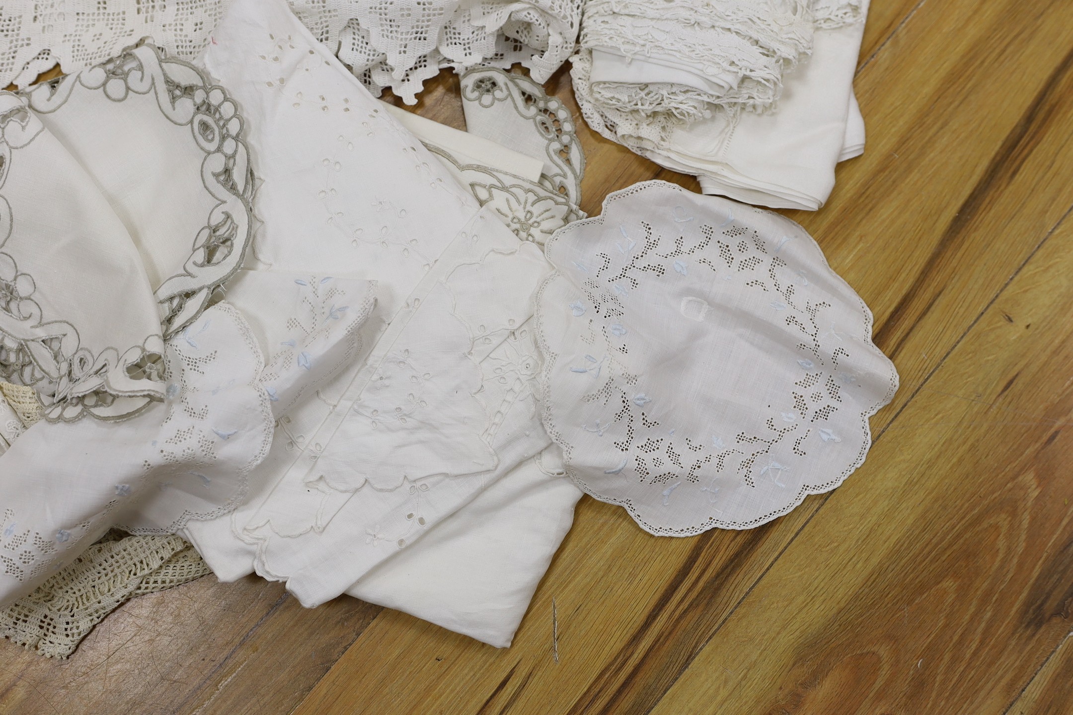 A collection of cut work and crochet edged table linens